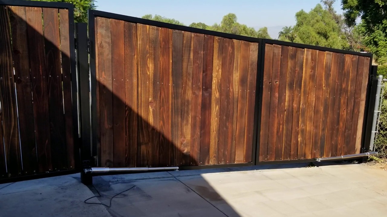 wrought iron gate project electric gate opener on slopped driveway