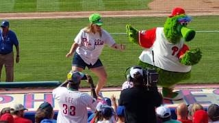 Sister dances with Philly phanatic on the dugout at Phillies vs cubs game