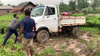 Tata 407 4x4 mini truck got stuck in slippery mud surface.