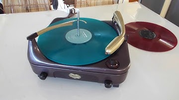 Voice of Music record player playing an LP record.