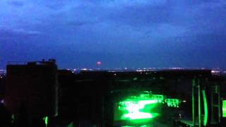 Moonrise over Denver from red rocks