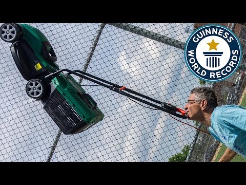 Farthest distance walked balancing a lawnmower on the chin (powered) – Guinness World Records