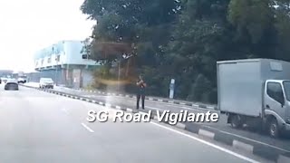 19feb2025  yishun dam singapore traffic police officer with  handheld laser speed detector