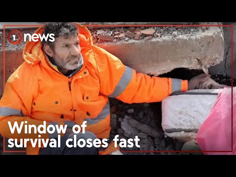 Father holds hand of daughter as she lies dead in Turkish earthquake rubble