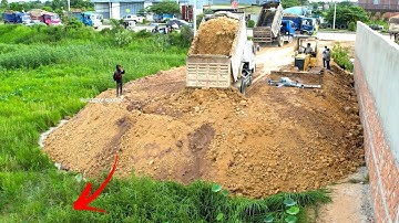 Wow landfill Flooded area by  using dump truck 5T unloading soil with bulldozer Komatsu D31p pushing