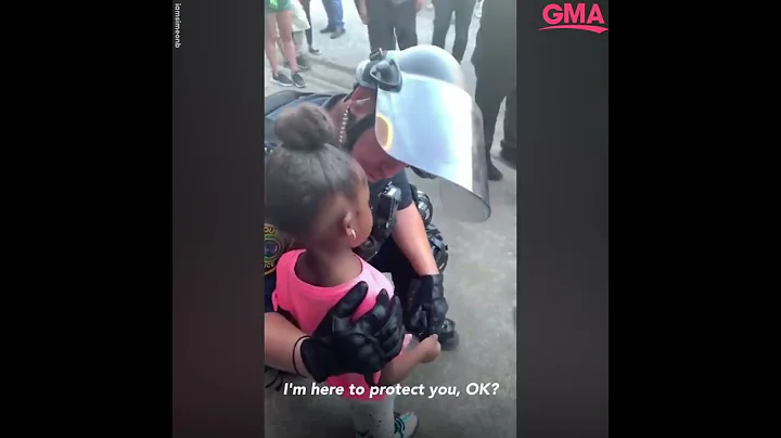 Police officer comforts little girl after she asks: 'Are you going to shoot us?' l GMA Digital