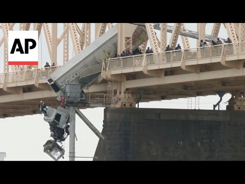 Truck driver rescued from dangling semi in Louisville, Kentucky