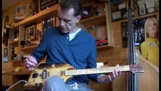 LOG GUITAR WITH RUSTY NAIL PICKUPS, CIGAR BOX INSPIRED BY JUNKSVILLE
