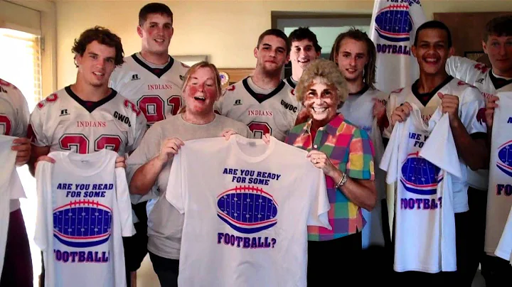 Kathy Henne Team donating T-shirts to Piqua Footba...