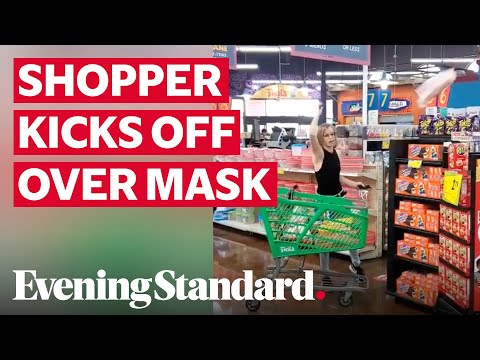 Moment shopper throws food out of trolley 'after being told to wear a face mask' in Dallas