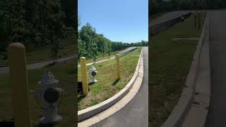 Guy crashes dirt bike jumping hill into parking lot