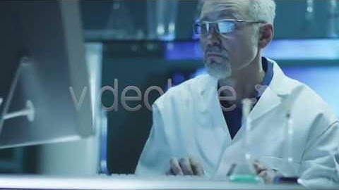 Scientist is Working on Computer in Laboratory - Stock Footage | VideoHive 11004007