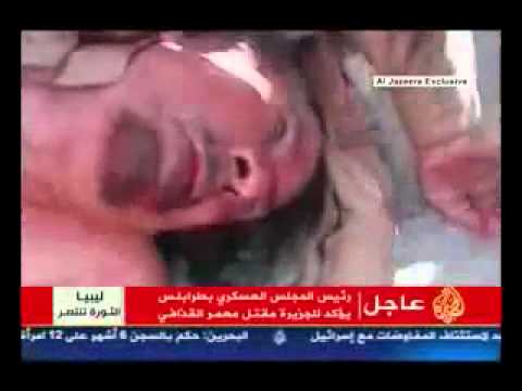 فيديو معمر القذافي مقتولا ومرميا على الارض ـــ عن الجزيره