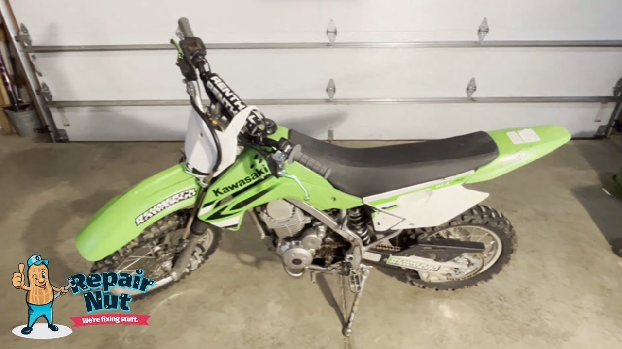 Kawasaki KLX 140 - Part 2 - Replacing chain & sprockets. Replace Rear Tire & Tube.