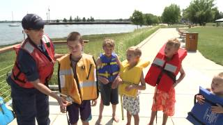 Gaye blind from the us coast guard auxiliary demonstrates how to
properly fit children with life jackets.
http://www.michiganwatertrails.org/