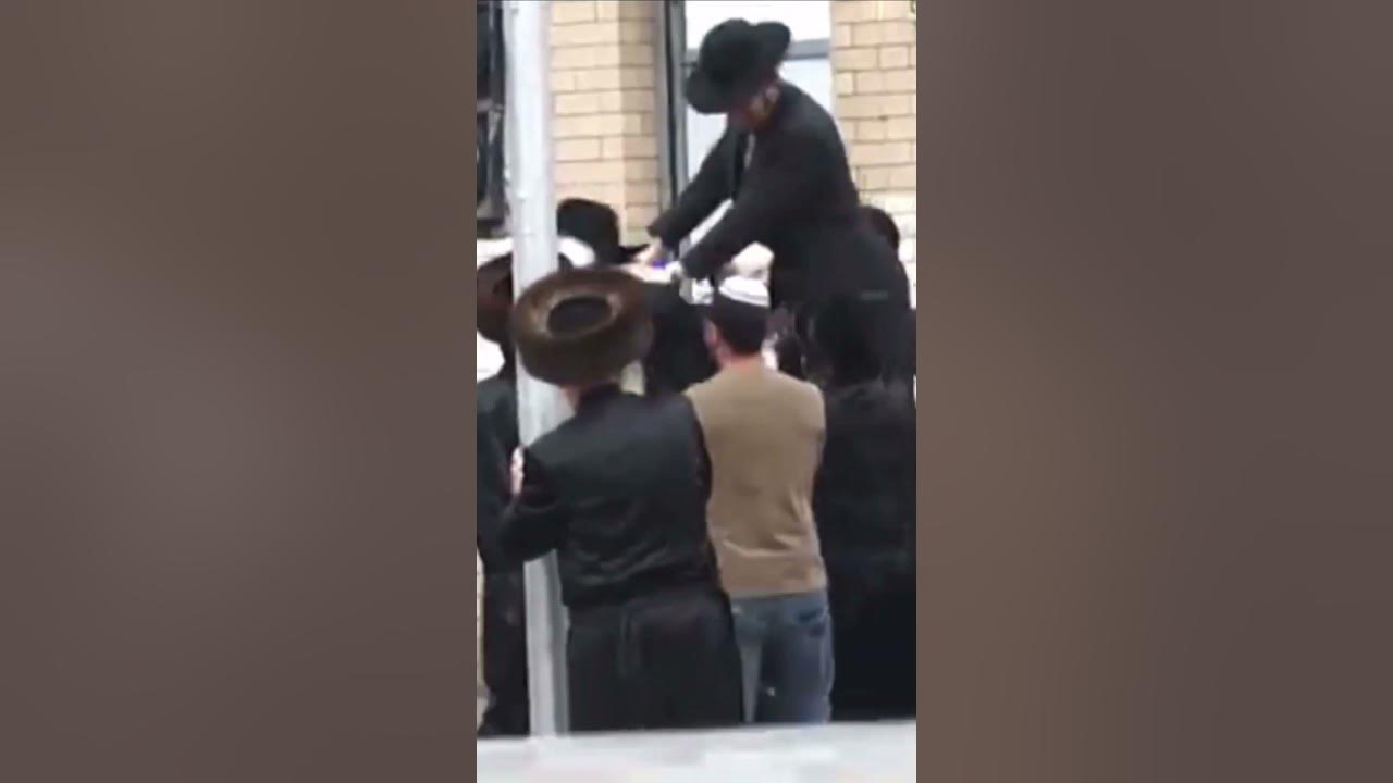 Jewish Hasidic Jews dance in the streets of Israel