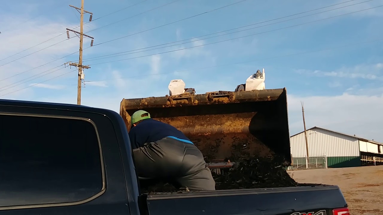 Loading 2 yards of black mulch in my small truck bed YouTube