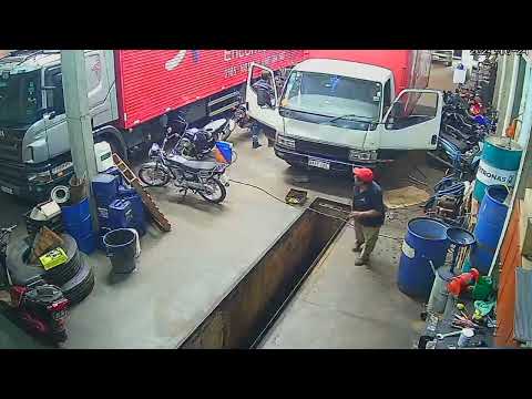 Mechanic Almost Falls Into Workshop Pit After Tripping