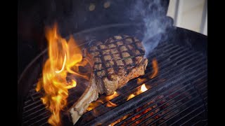 Tomahawk steak on charcoal grill cooked to perfection