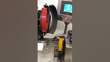 Calendar hanger making machine