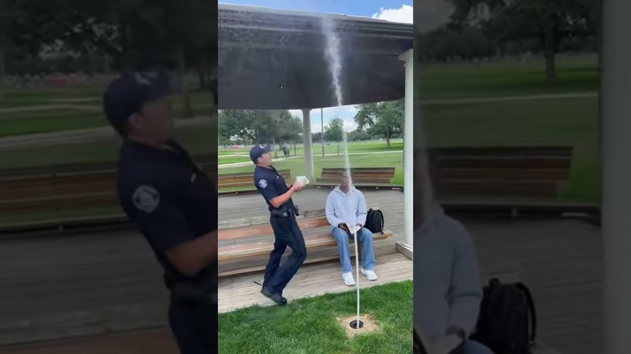 Полицейский пытается выписать штраф, а вместо этого промокает насквозь 