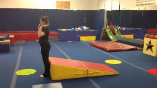 Backward roll straddle down the cheese
