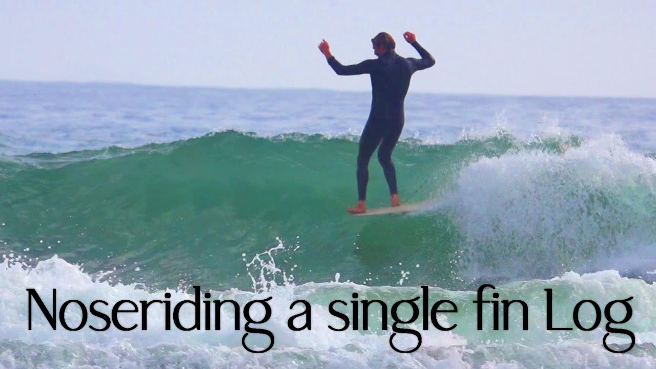 Noseriding a single fin Log - Fraser on a ColourSphere.