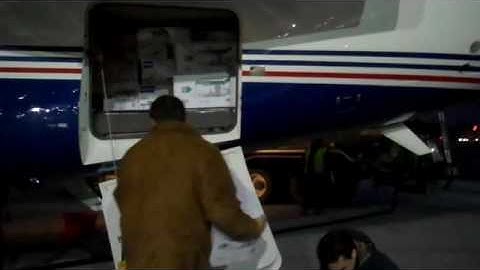 Matt Dalio and Carl Kuehner loading supplies