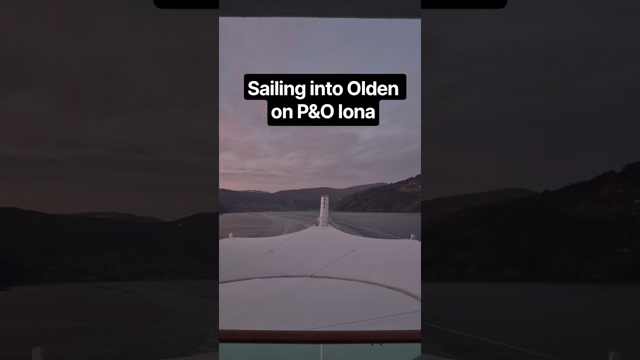 Sailing into Olden Norway view from aft of P&O Iona balcony cabin Norweigan Fjords