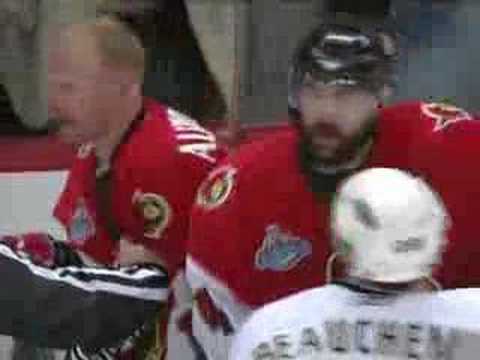 Daniel Alfredsson shoots the puck on Niedermayer