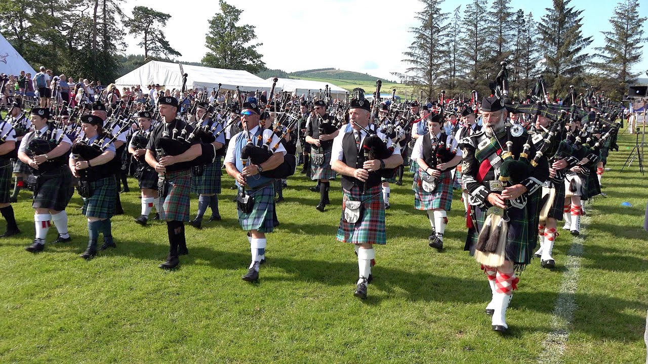 2019 Dufftown Highland Games afternoon parade by the Massed Bands led ...