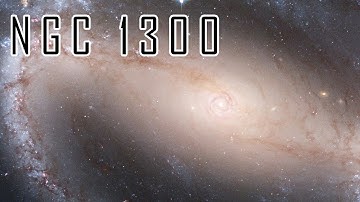 NGC 1300: Dive into the Majestic Barred Spiral Galaxy – A Cosmic Masterpiece by Hubble!” 🚀🌌✨