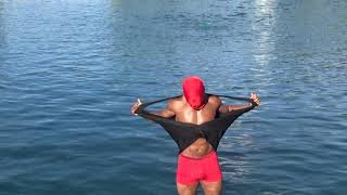 Faceless shirt ripping in water