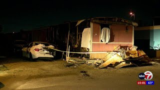 Camera captures mobile home fire moments before neighbors help rescue one person