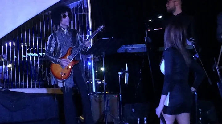 PRINCE jumps on stage with Nikki Leonti for a guit...