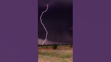 Thumbnail of Absolutely gargantuan double lightning strike from a powerful supercell (wall cloud in the BG!!)