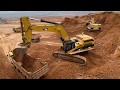 Two Cat 365C Excavators Loading Trucks