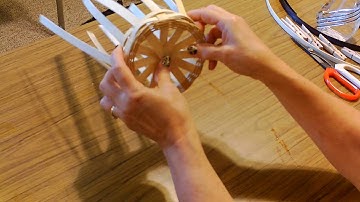 Basket making with Cheryl and Edie - bumping up the rolling bottom of a round basket