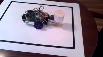 Boe-bot uses laser sensor to find target, grab it, and move it out of a ring.