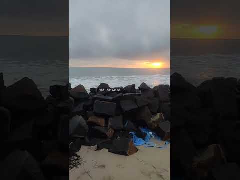 Sunset behind the waves