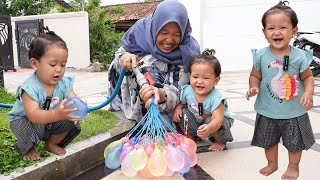 ARACELLI PLAYING WITH BREAKING COLORFUL WATER BALLOONS