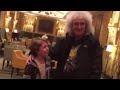 Brian may meets  signs autograph for tearful emotional young queen fan