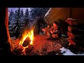 Solo winter bushcraft camp  building shelter  making a bow saw  long fire