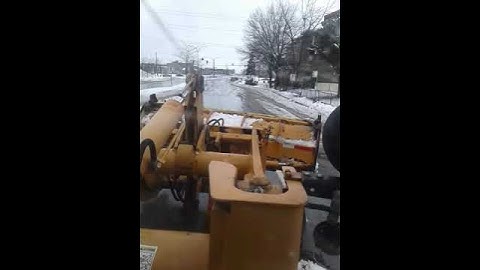 CASE 321d plowing packed snow