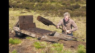 Traditional Cutting Peat and Turf in a bog in Ireland