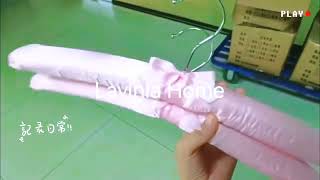 Pink satin hangers displayed in the Lavinia Home warehouse. screenshot 2