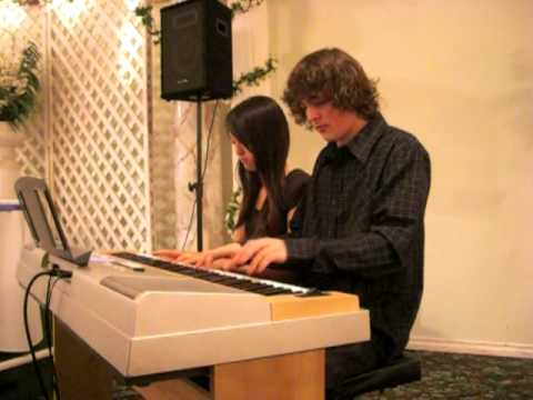 "In The Mood" piano duet performed by Jimmy Wainwr...