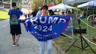 Dozens of Trump fans gather outside Georgia jail to show support ahead of his expected surrender