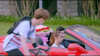 Seeing his beloved woman get into the luxury car of his rival, the poor boy felt heartbroken.