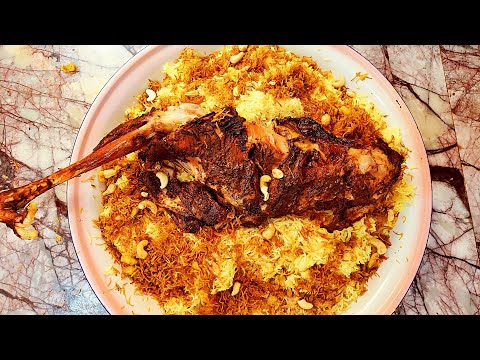 طبخ تمن المشخل بالتنور الطين مع القوزي